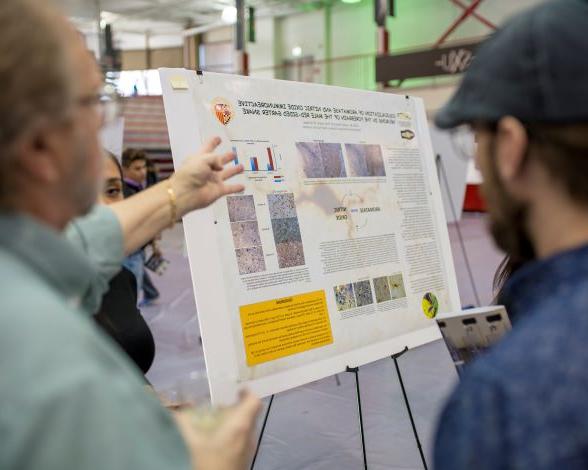 Student and faculty at 2019 Research Expo